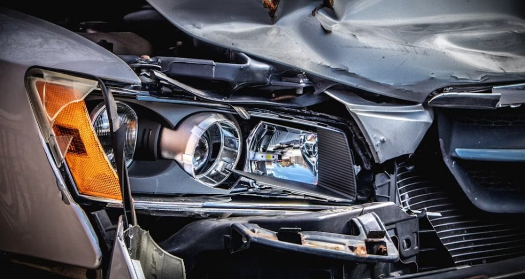silver car close-up of crash damage