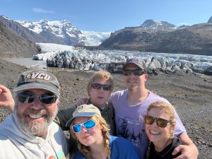 Attorney Stephen Harper, Lawyer of the Year, posing with his family on a glacier