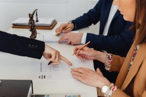 lawyer signing paperwork