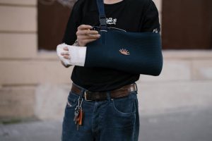 person with arm in a sling on disability