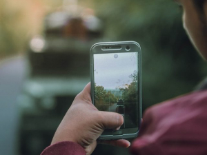 Man taking photo of his car accident