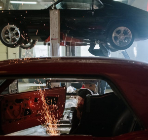 Car being fixed in auto shop after a car accident