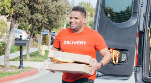 dELIVERY DRIVER CARRYING PACKAGES