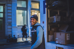 a delivery driver smiling